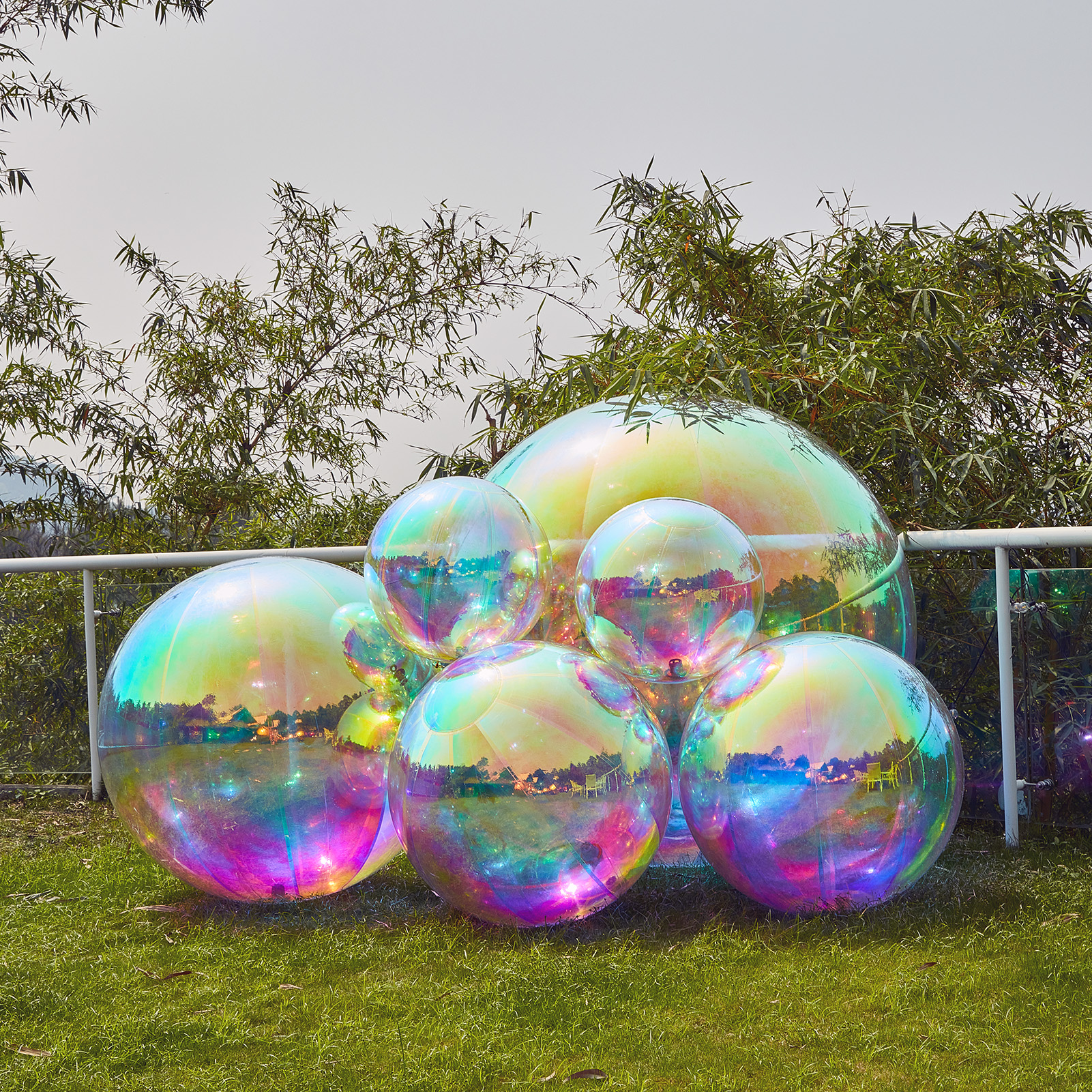 The smooth mirror surface of the colorful inflatable mirrored ball, a big shiny ball, can clearly reflect the surrounding environment and skillfully blend light and color together Inflatable Mirror Ball Combination Set - 6 Colourful Balls - Image 5